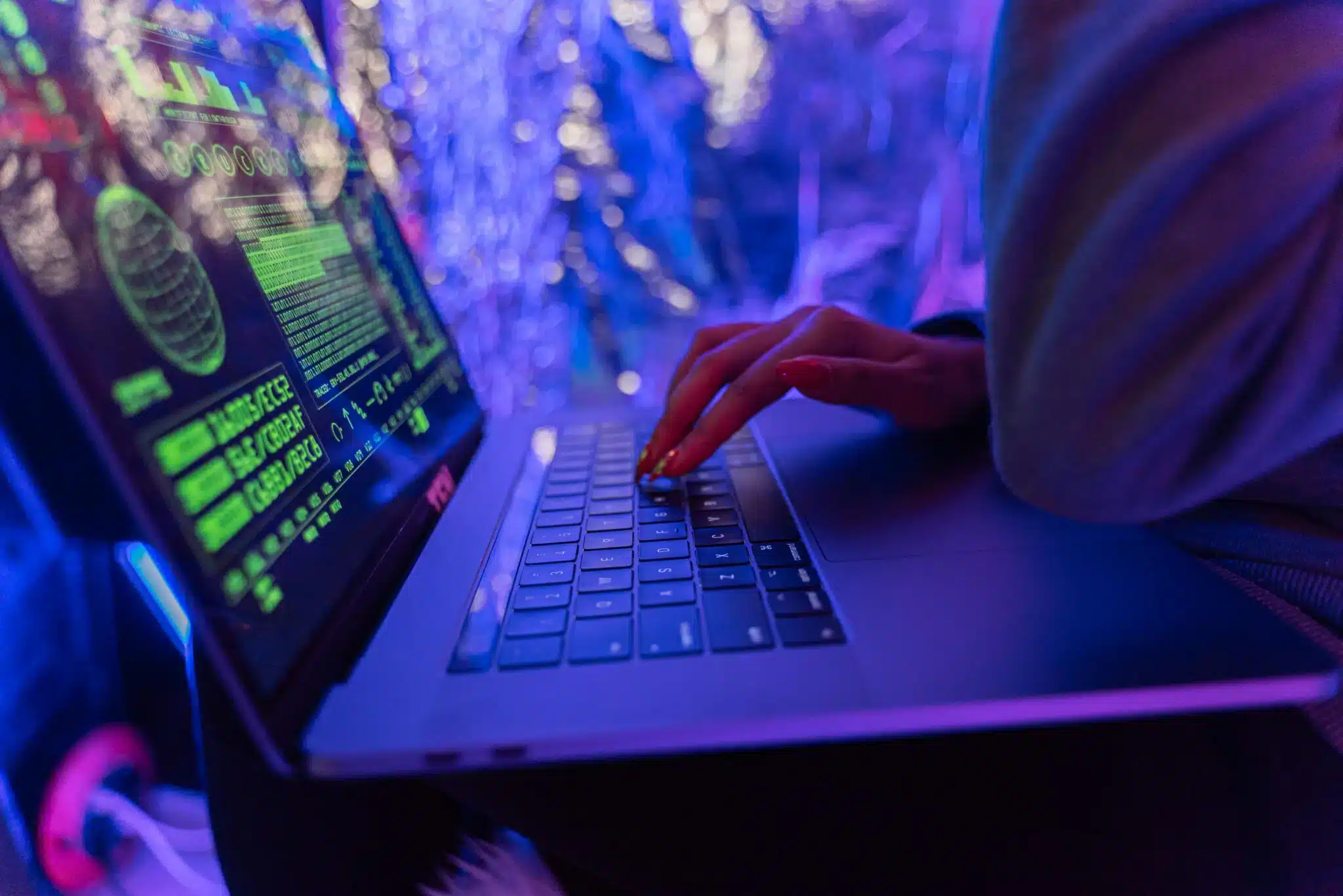 a sideview of a hand using a laptop