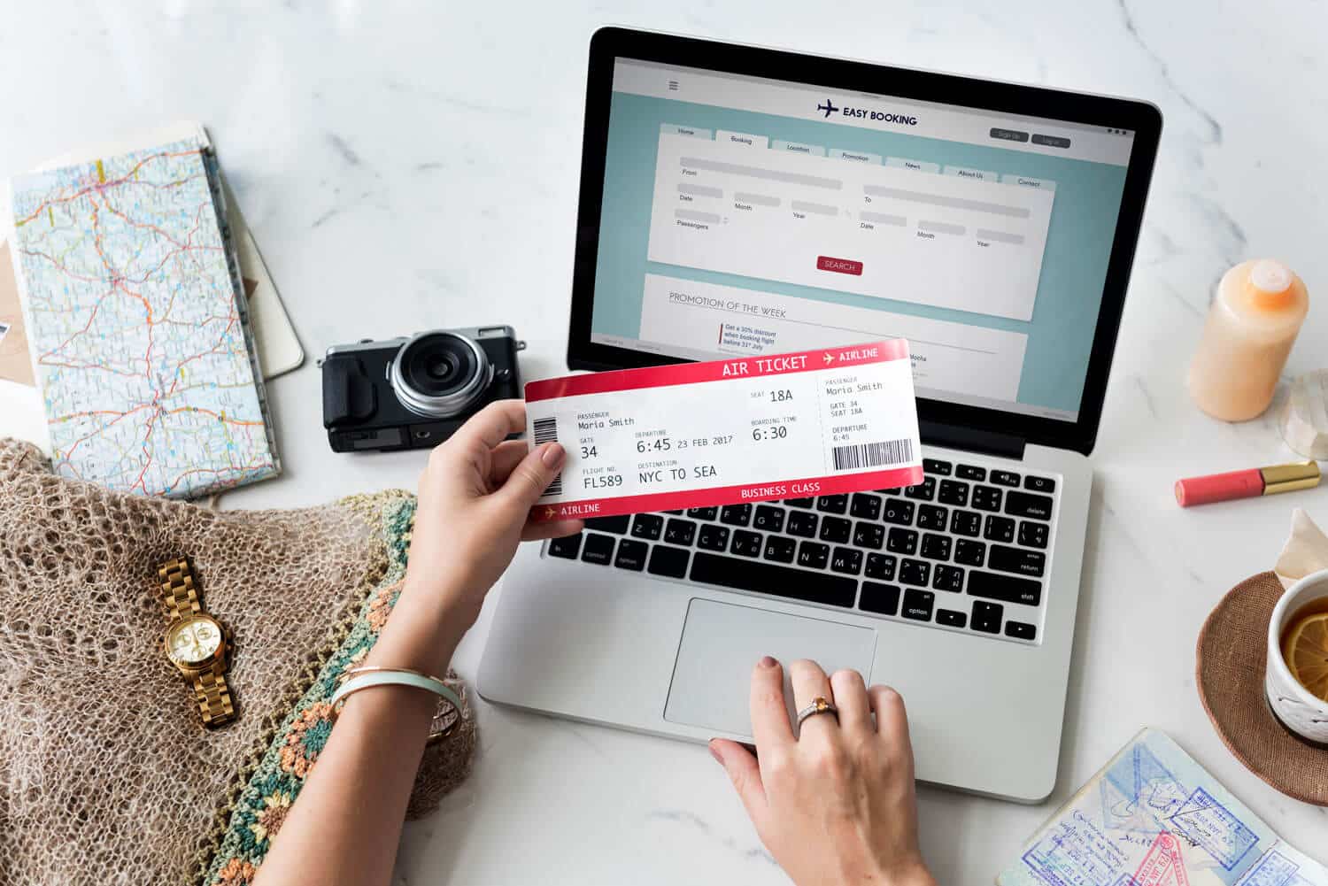 Person purchasing flight ticket on computer