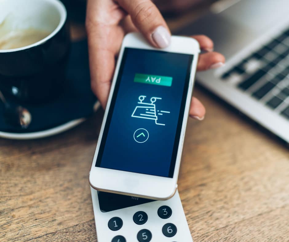 person using phone to checkout wirelessly at a POS