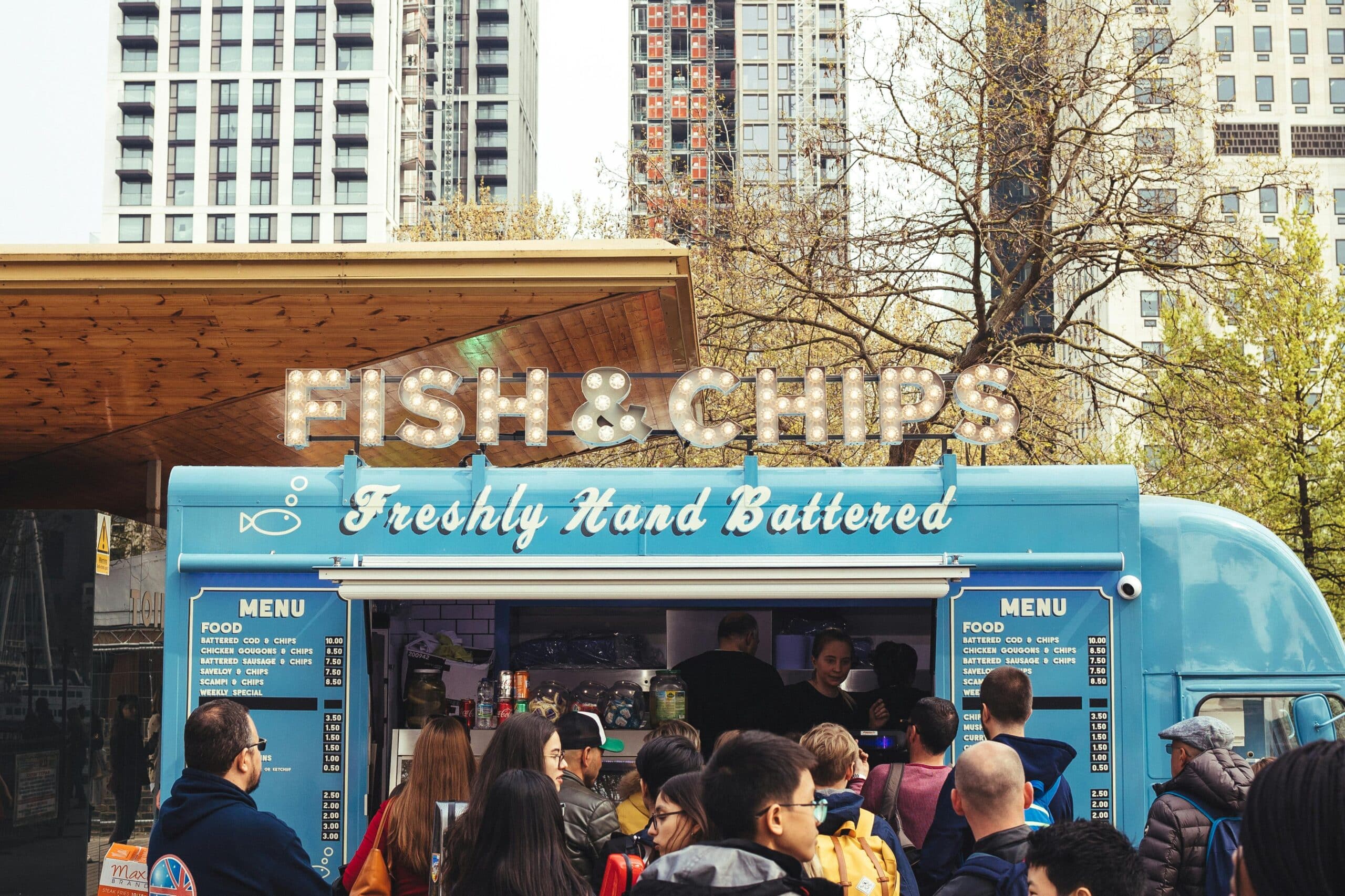 Fish and Chips Food Truck with large number of customers outside illustrating the need for efficient credit card processing