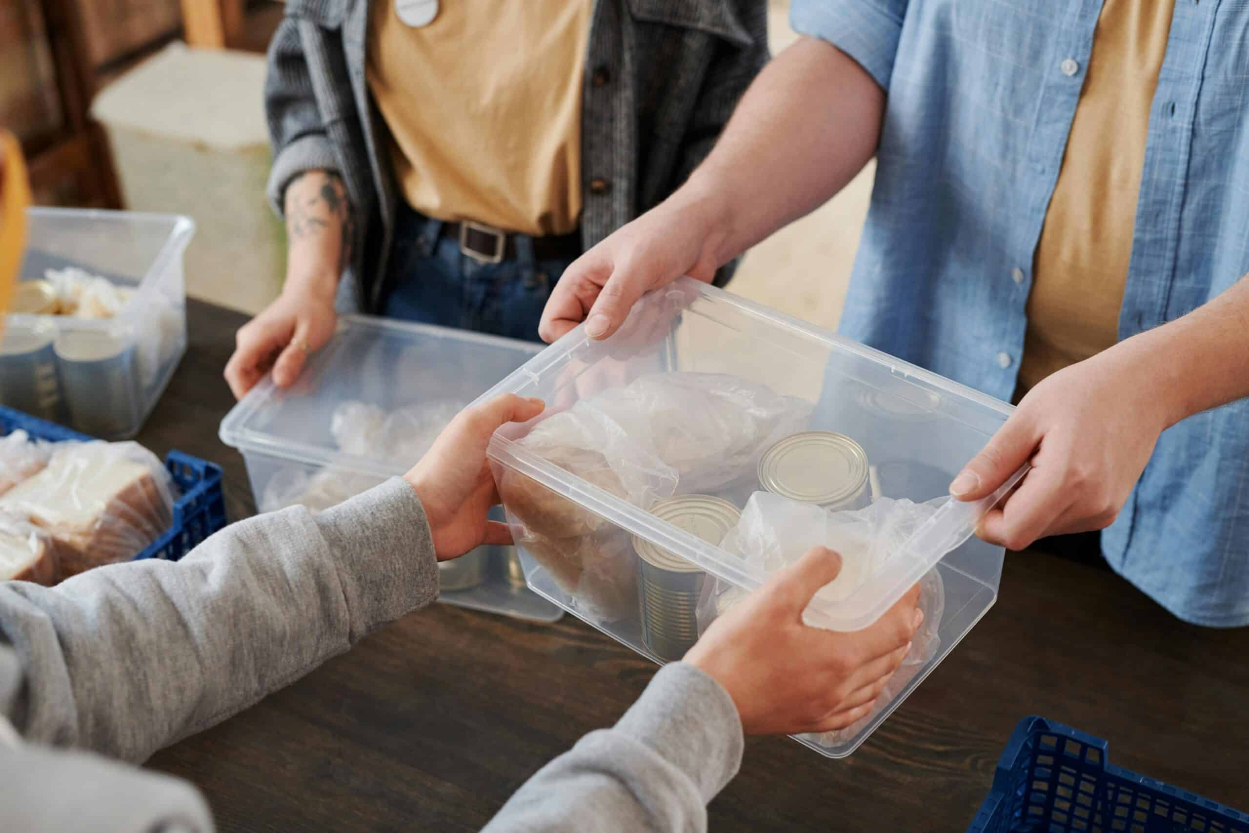 Box of canned food and supplies illustrating non-profit organization