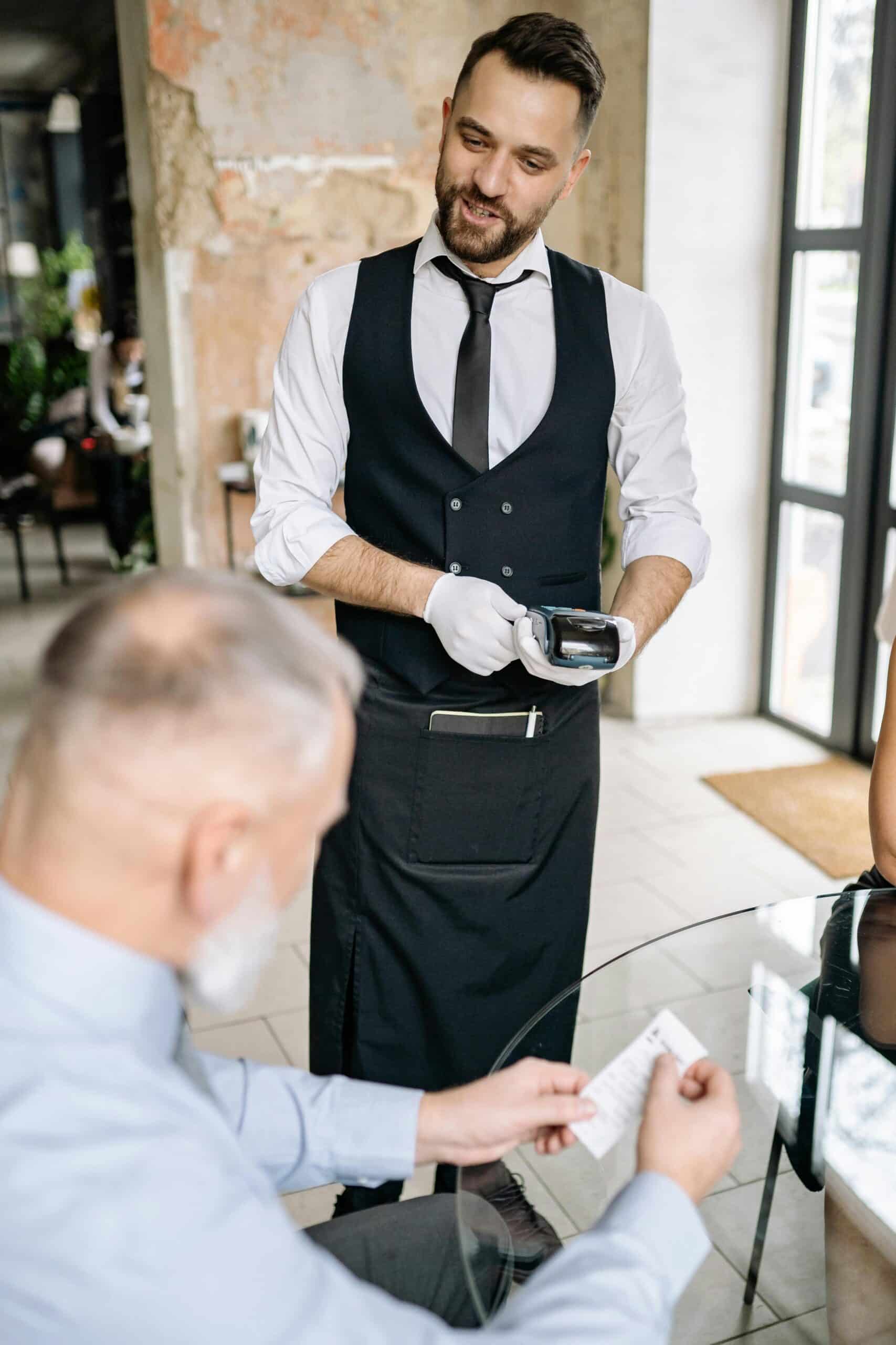 Server using credit card processor at table
