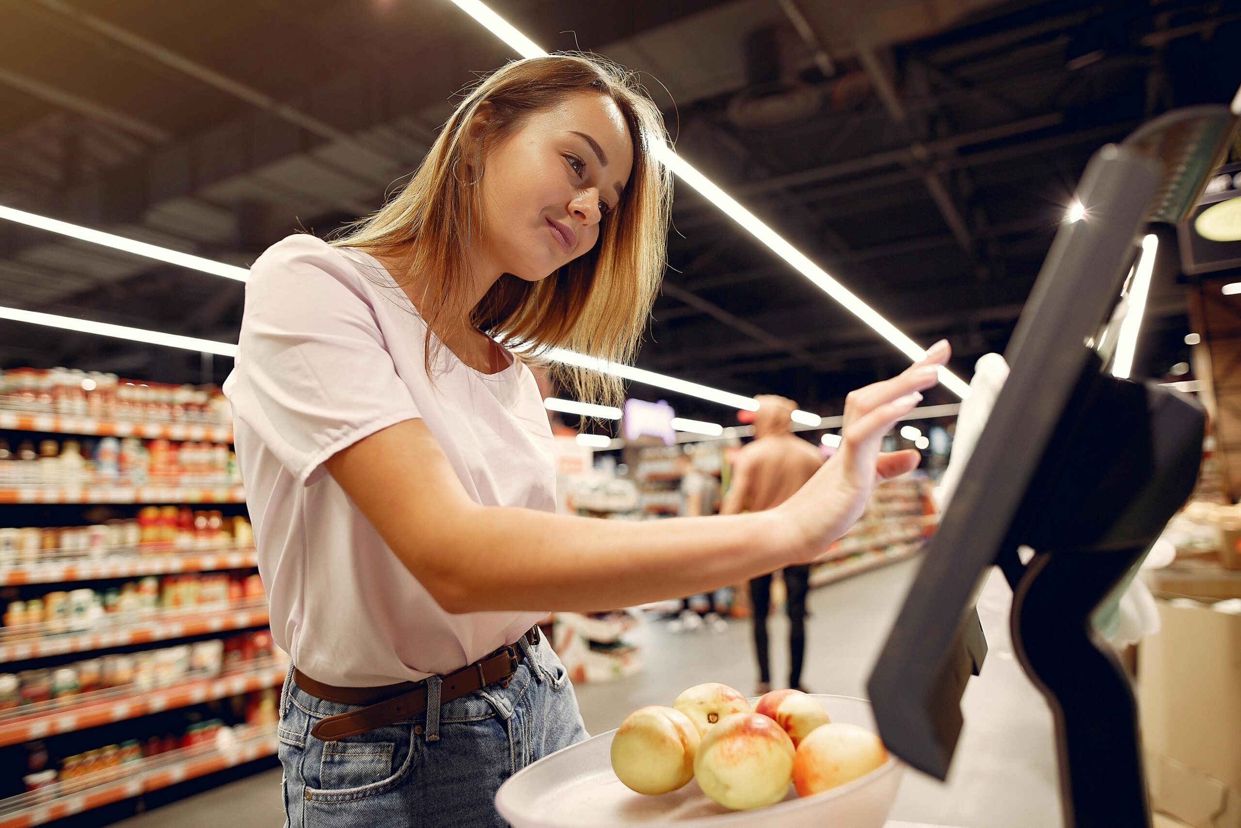 Self-checkout kiosk; Walmart POS system handling millions of daily transactions