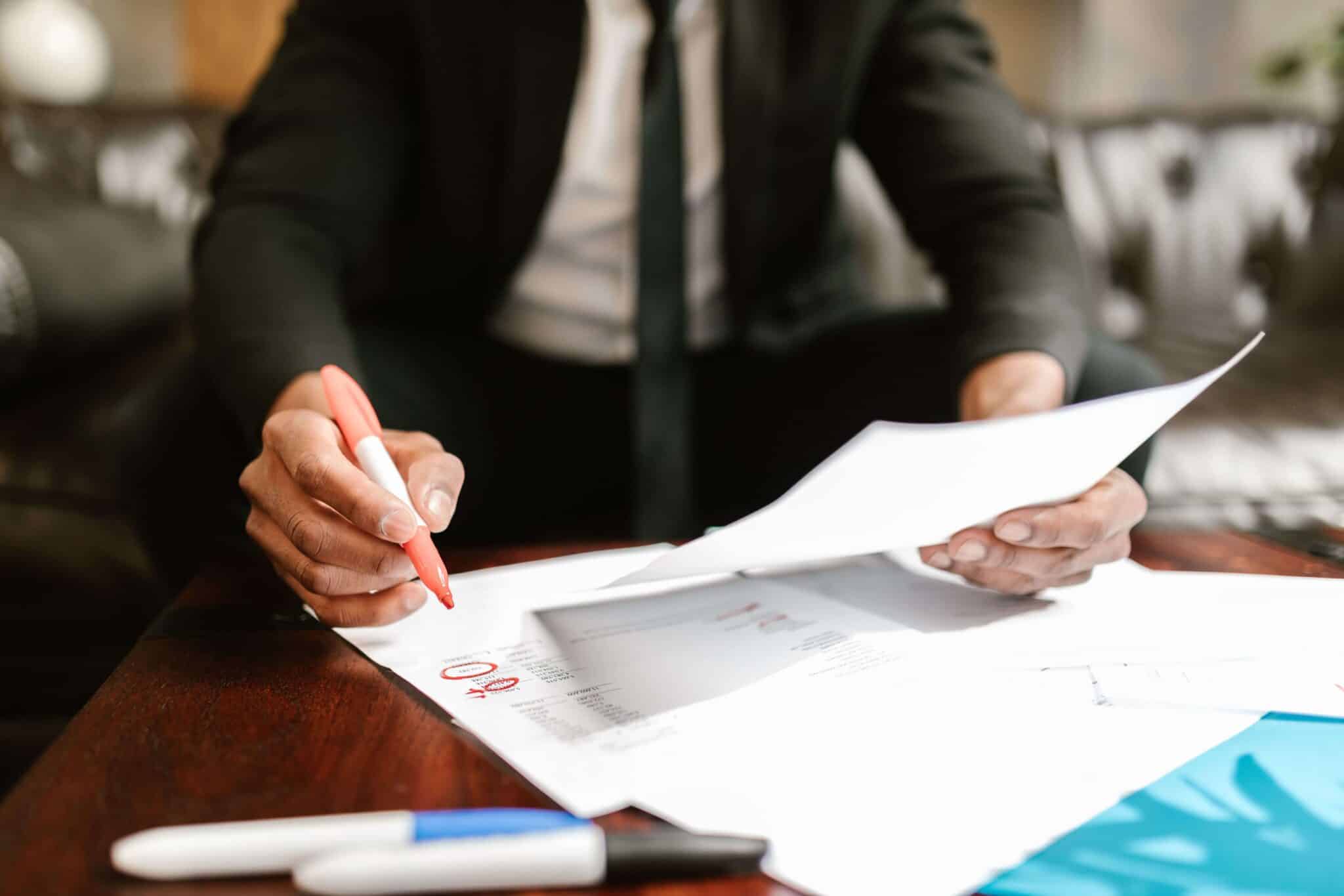 Man reviewing financial paperwork