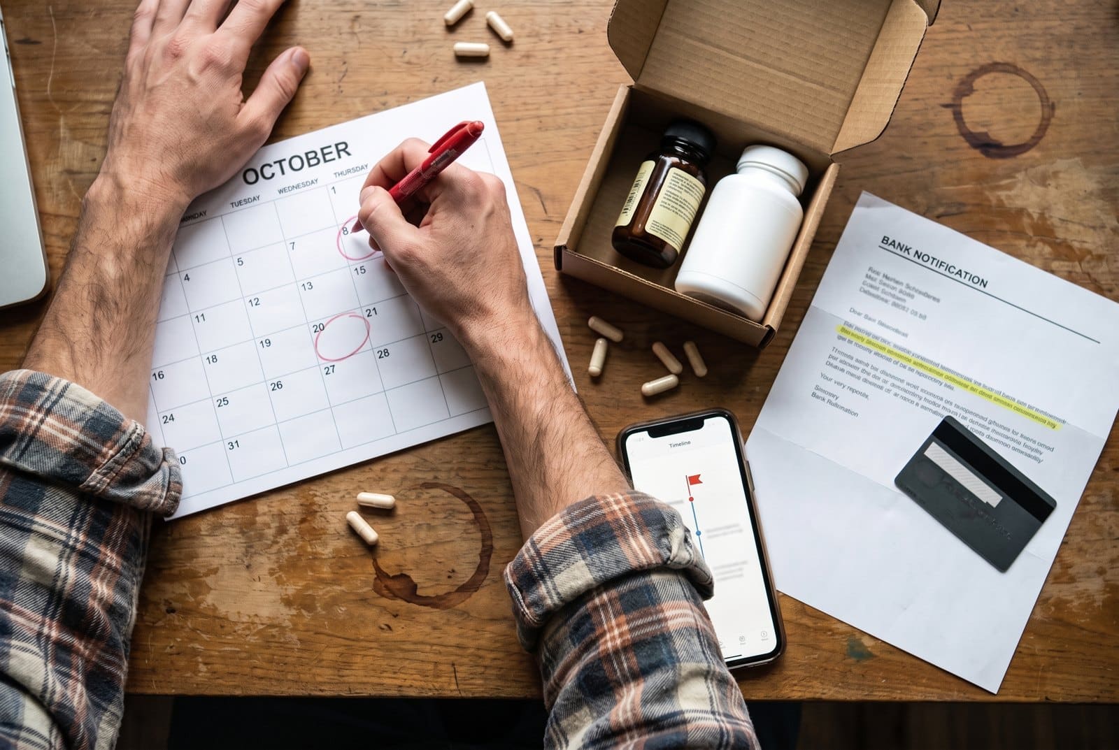 Supplement brand owner circling free-trial renewal dates on a calendar beside a trial bottle shipment and a bank chargeback notice
